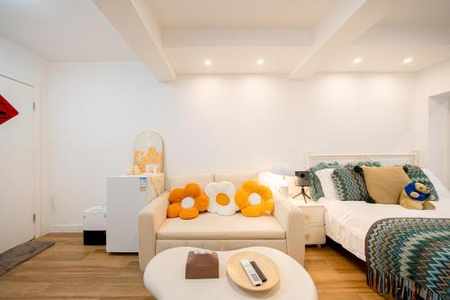 a living room with a couch with stuffed animals on it at Shanghai Hills & Well-time Velvet Glow Near Tianzifang and Riyueguang Center close to Line 9 in Shanghai