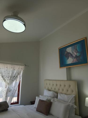 Ένα ή περισσότερα κρεβάτια σε δωμάτιο στο Neats Accommodations