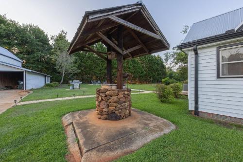a sculpture in the yard of a house at The Bulldog Farmhouse - 100 year old home in Athens
