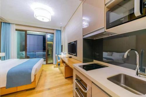 Ein Bett oder Betten in einem Zimmer der Unterkunft Yizhimei Light Residence