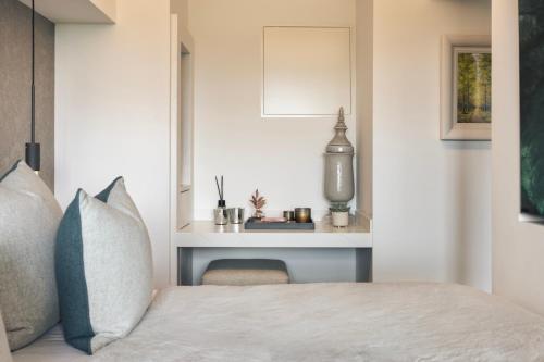a bedroom with a bed and a desk at The Retreat in Penruddock