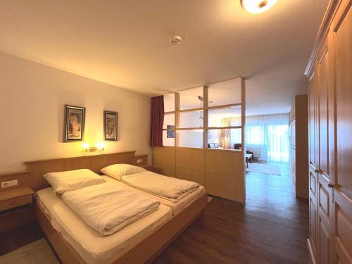 Ένα ή περισσότερα κρεβάτια σε δωμάτιο στο Rubiblick, Montana Haus