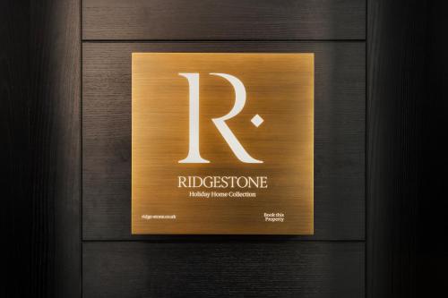 a wooden door with a sign that says rhodesisitance at The Sanctuary - Ridgestone in Watermillock