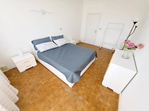 a bedroom with a bed and two night stands at Poerio Apartment Your Venice Gateway in Mestre in Venice