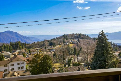 a view of a town with mountains in the background at Villa Leopoldina in Premeno