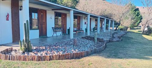 a group of birds sitting on the porch of a house at Intaba Lodge in Elliot