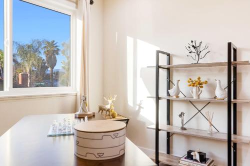 a living room with a table and a window at #Marbella Lane - Cozy Gem Near Nature Trails in West Covina