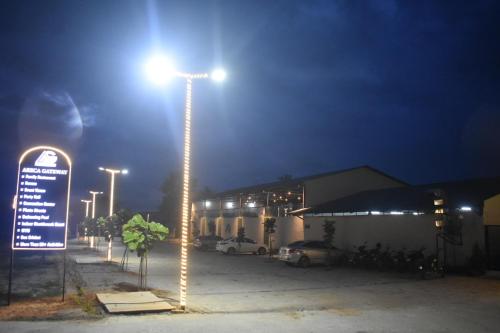 a street light in a parking lot at night at Areca Gateway Eco Tourism Center in Nandigunda