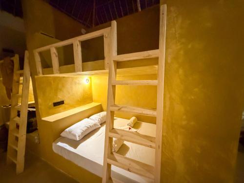a room with two bunk beds in a room at Hostel 197 in Nungwi