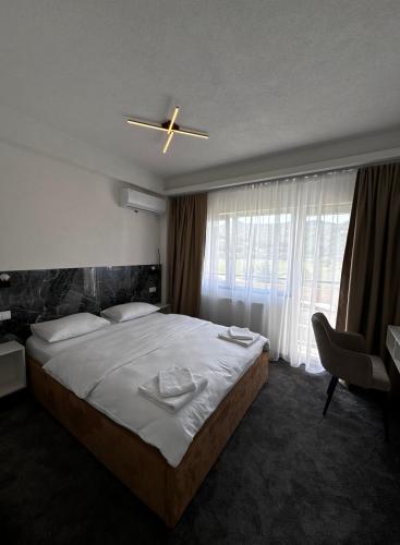 Postel nebo postele na pokoji v ubytování Hotel Turist