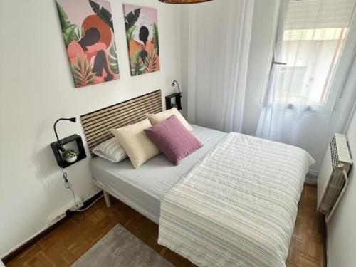a bedroom with a bed with pillows on it at Living Haro by Clabao in Haro