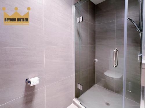 a bathroom with a shower with a toilet at Discover Avondale - 10 Sec Walk to Sunday Market in Auckland