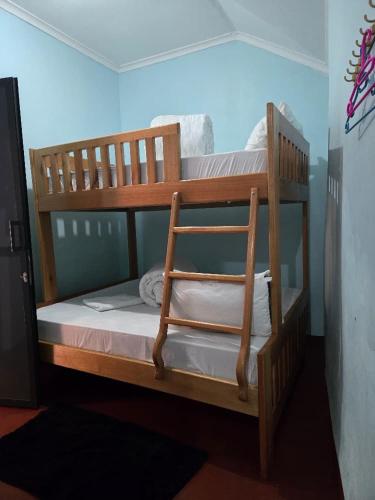 a couple of bunk beds in a room at Kisanga Homestay in Moshi