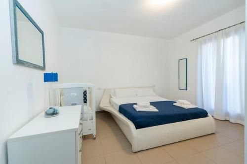 Postel nebo postele na pokoji v ubytování Appartamento luminoso e pratico con spazio esterno