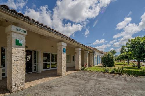 a view of the front of a building at Village Vacances Passion L'Emeraude in Damvix