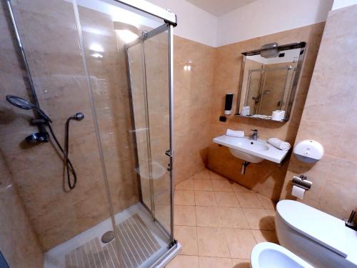 a bathroom with a shower and a sink at Hotel Mariuccia in Varese