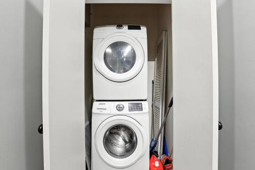 a washing machine and a washer in a room at NEW LISTING The Townie Retreat - Walk to Stadium in Athens