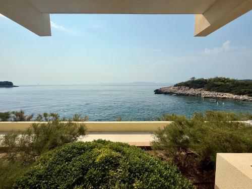 a view of the ocean from a house at Hotel Priscapac Resort & Apartments in Prizba