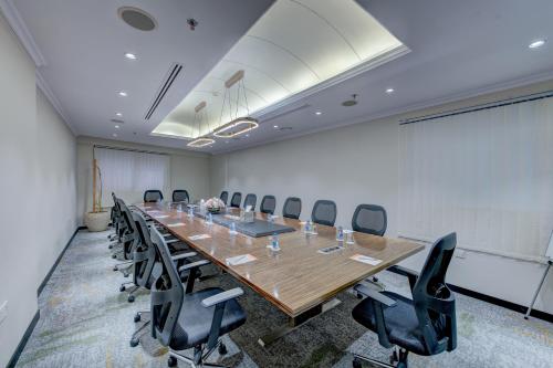 a large conference room with a long table and chairs at Howard Johnson Plaza by Wyndham Dubai Deira in Dubai