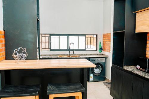 a kitchen with a sink and a counter top at Ndare Eco Ville in Kigali