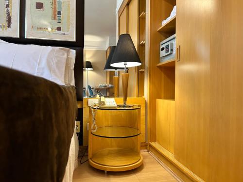 Postel nebo postele na pokoji v ubytování TOP quarto Stay Inn hotel 3 min Av Paulista