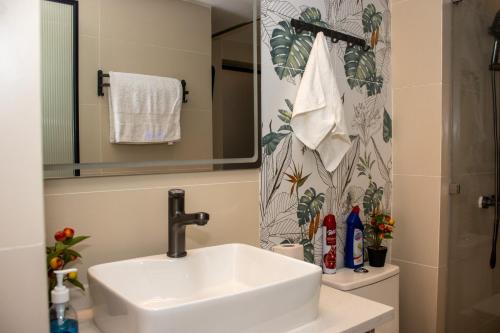 a bathroom with a sink and a shower at Titonova Vista Homes in Nairobi