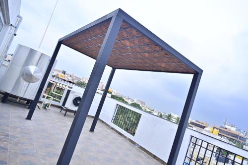 a view from the balcony of a building at Hotel Noble Nook, 100 Ft Road, Indiranagar in Bengaluru