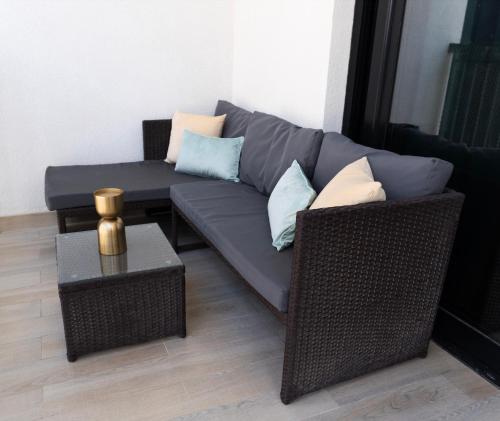 a living room with a couch and a table at Chic Family 2br, Canal Views! Near Ferrari World in Abu Dhabi
