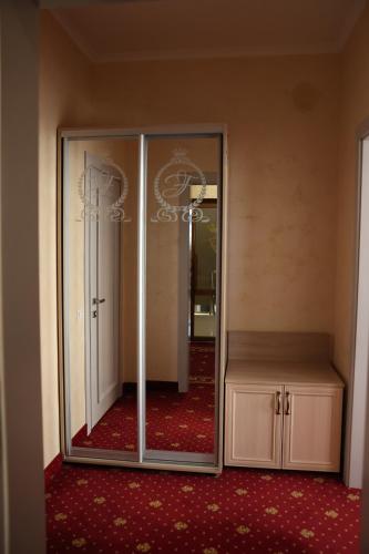an empty room with a large mirror in a room at Hotel France in Vinnytsya