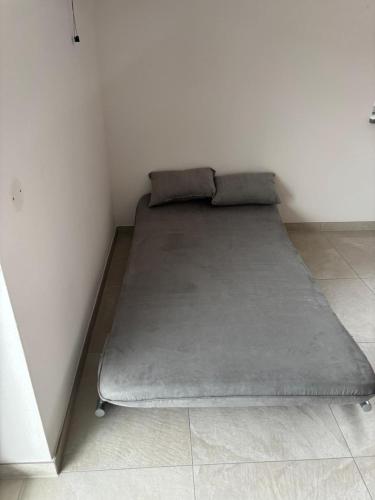 a bed in a corner of a room at Boardinghaus Koucha - Wohnen auf Zeit in Neuburg an der Donau