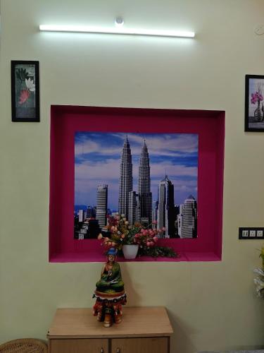 a picture on a wall with a picture of the city at KL homestay in Trichy in Tiruchchirāppalli
