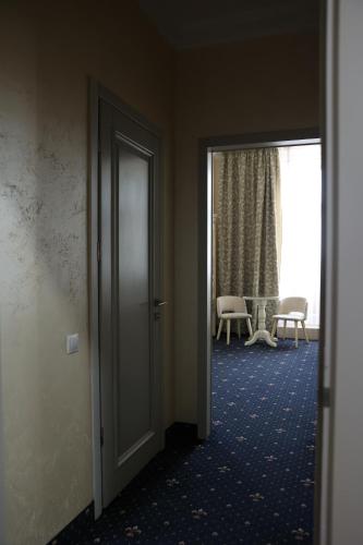 an open door to a room with a table at Hotel France in Vinnytsya