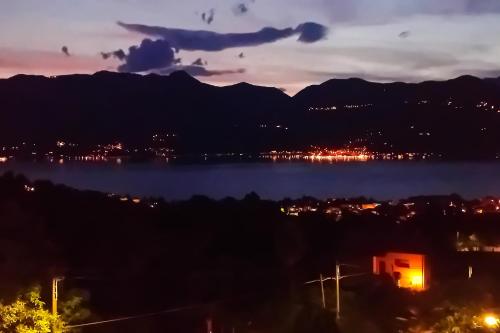 a view of a body of water at night at Panorama e Relax in Germignaga