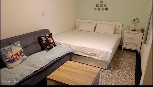 Ένα ή περισσότερα κρεβάτια σε δωμάτιο στο 摩登旅宿