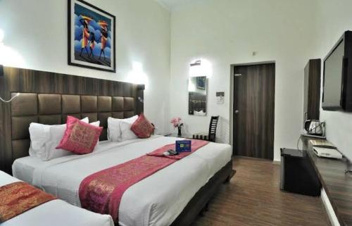 Ένα ή περισσότερα κρεβάτια σε δωμάτιο στο Hotel Best Family Rooms