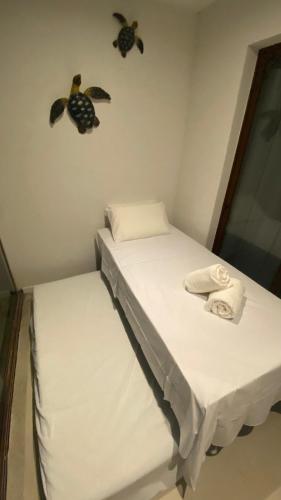 Ένα ή περισσότερα κρεβάτια σε δωμάτιο στο Brisa do Mar loft