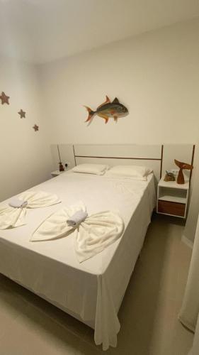 Ένα ή περισσότερα κρεβάτια σε δωμάτιο στο Brisa do Mar loft