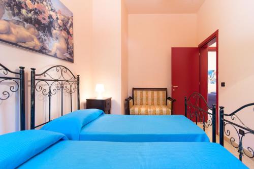 Llit o llits en una habitació de Villa Maria Antonietta