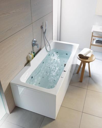a white bath tub in a white bathroom at Desert Island Camp & Resort Jaisalmer in Jaisalmer