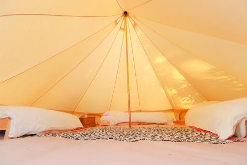 Katil atau katil-katil dalam bilik di Naumad - Guest House