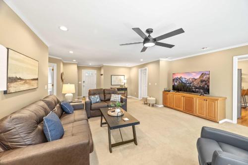 a living room with a couch and a ceiling fan at Cookeville Family Retreat 3BR Home with Yard Close to TTU & Town in Cookeville