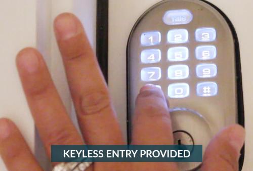 a persons hand holding a keyless entry remote control at 2072 - Laughing Duck in Duck