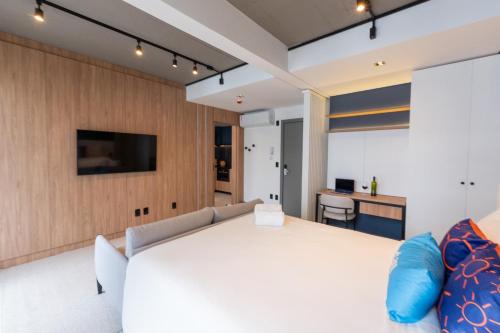 Postel nebo postele na pokoji v ubytování Xtay Oslo Florianópolis - Estúdios completos e bem decorados, em região privilegiada
