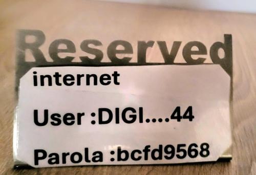 a sign on a wall that reads renewal internet user ddh at Guest house in Otopeni
