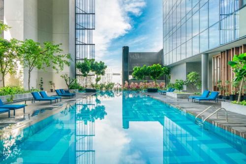 an image of a swimming pool in a building at Oasia Hotel Downtown, Singapore by Far East Hospitality in Singapore