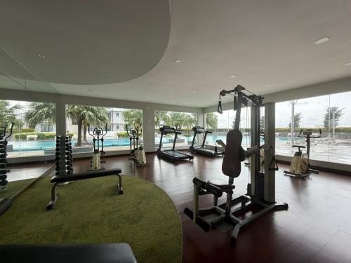 a gym with several tread machines and a large window at PB1406 Two bedroom 6-7pax beside paradigm mall in Johor Bahru