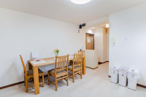 a dining room with a table and chairs at 303Room,Tokyo Koiwa 6min Walk to Station 1BR Apartment for up to 4 Guests in Tokyo