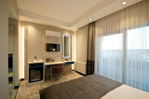 Кровать или кровати в номере Starton Hotel