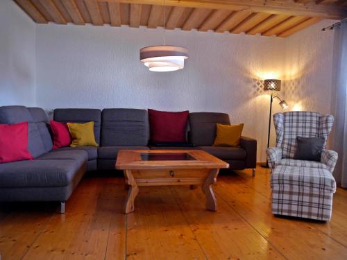 a living room with a couch and a coffee table at Ferienhaus Kirchl in Hohenau