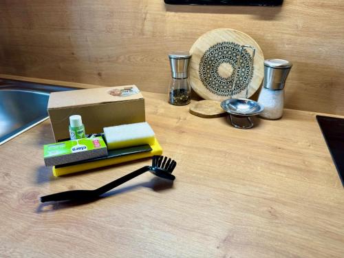 a table with a fork and a box and a fan at Holiday Home Marianne in Velké Svatoňovice